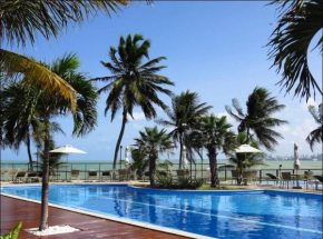 Apartamento a beira mar com piscina estilo resort